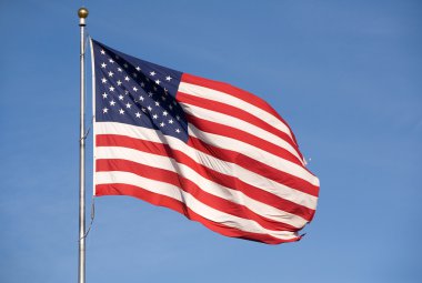 The American flag waving in the air. clipart