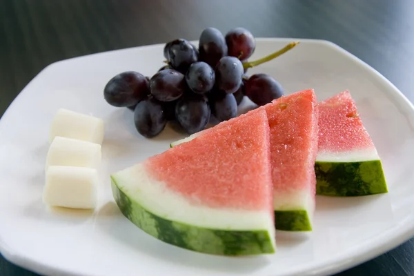 Watermelon, cheese, and grapes. — Stock Photo, Image