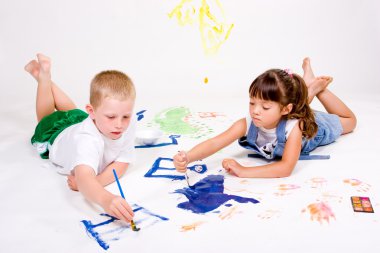 Children having fun painting. clipart