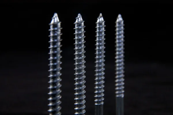 Tips of four screws. — Stock Photo, Image