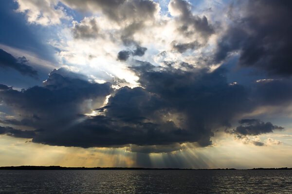 A dramatic sky over a large lake