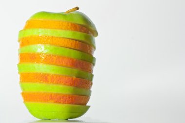 An apple and an orange becoming one clipart