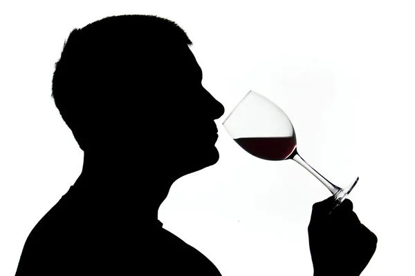 シルエットのワイン臭いがする男 — ストック写真