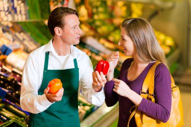 Woman in a supermarket at the clipart