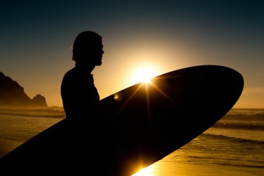 Young surfer on the beach with clipart