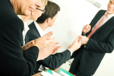 Business team applauding after clipart