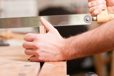 Carpenter working on a hand clipart