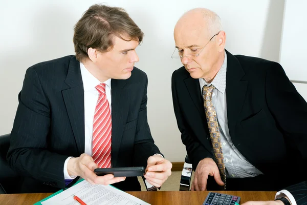 Businesspeople crunching the — Stock Photo, Image