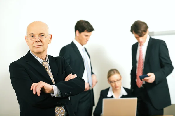 Businesspeople crunching the — Stock Photo, Image