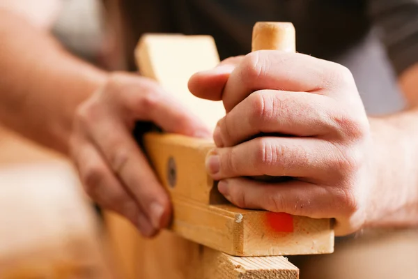 Carpenter working with a — Stock Photo, Image