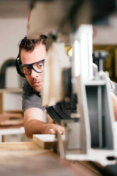 Carpenter working on an — Stock Photo, Image