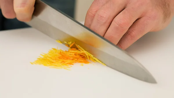 Man cutting orange and citron — Stock Photo, Image