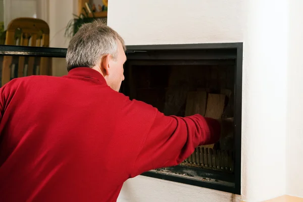 stock image Inflaming the fireplace