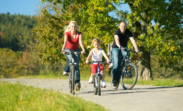 Family with one child riding — Stock Photo, Image