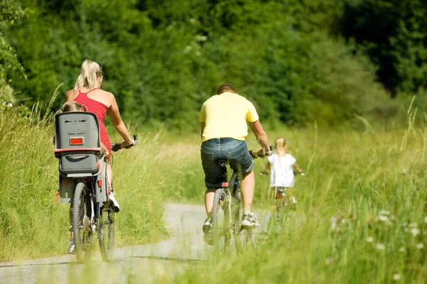 Family with child on their bikes — Stock Photo, Image