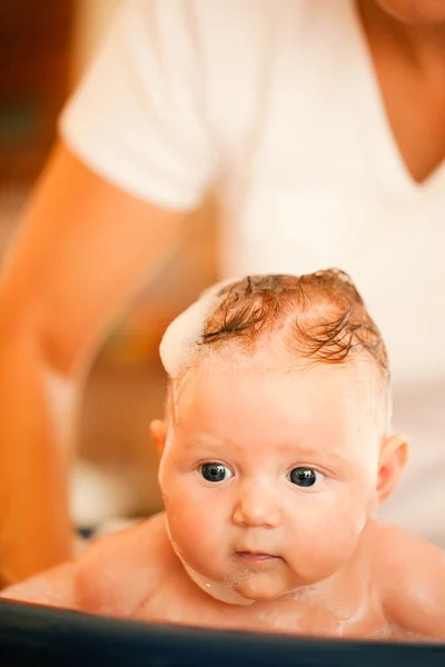 Baby having a bath in the — Stock Photo, Image