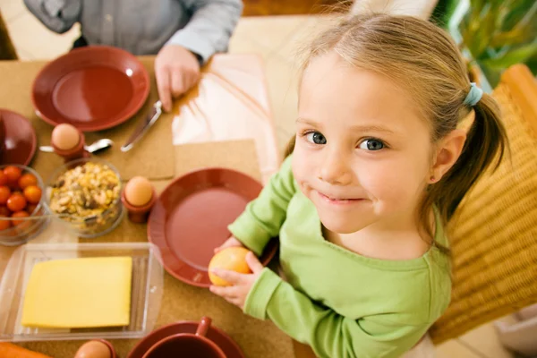 Little girl eating breakfast or — Stock Photo, Image