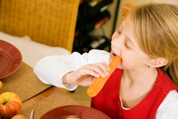 Little girl eating breakfast or — Stock Photo, Image