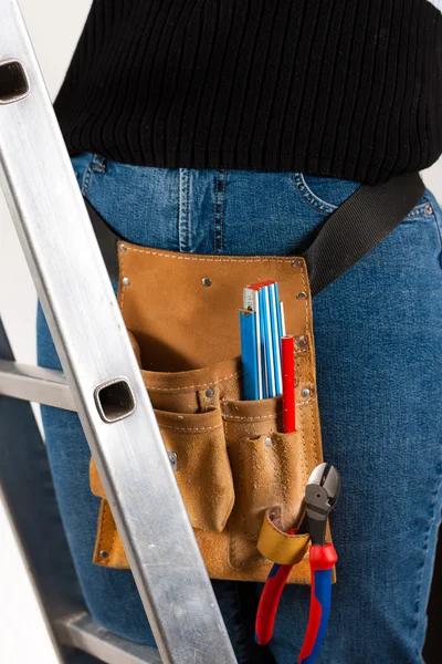 Female worker on a ladder with — Stock Photo, Image