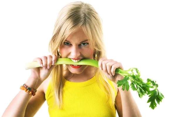 Blond woman in yellow eating — Stock Photo, Image