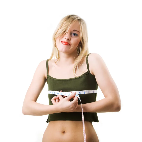 Жінка вимірює свою талію — стокове фото