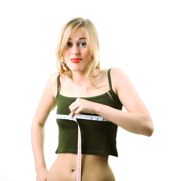 Жінка вимірює свою талію — стокове фото