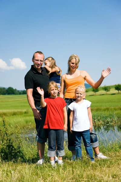 Family in the grass at a Stock Picture