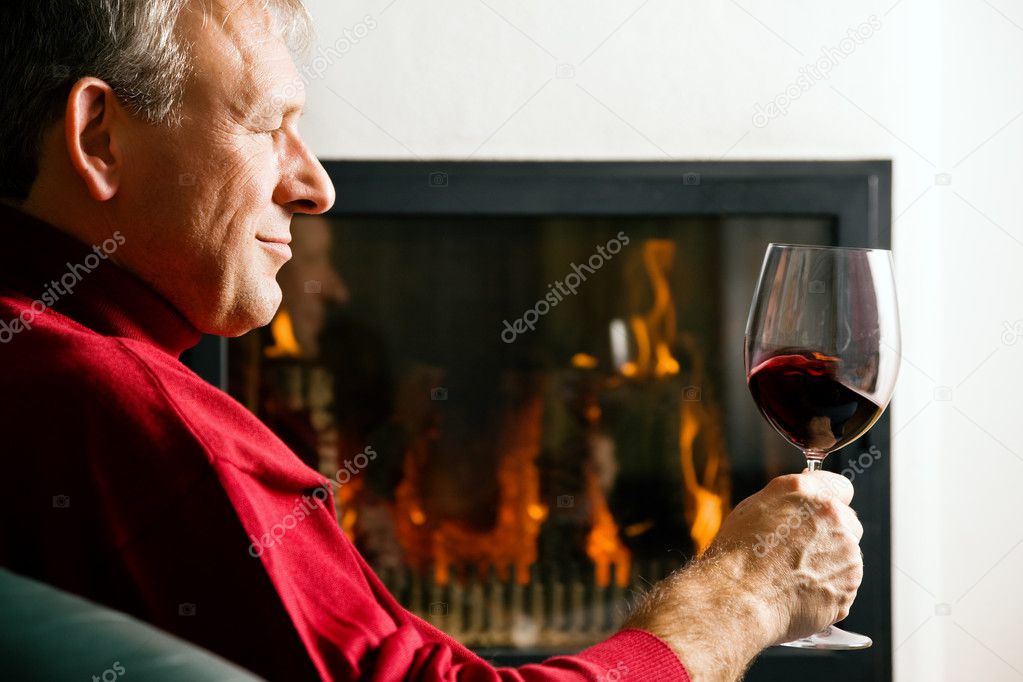 Mature man enjoying a glass of