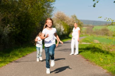 Kids running down a path in clipart