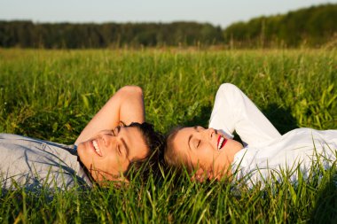 Young couple lying together on clipart