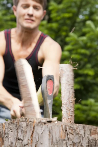 Man in his garden chopping — Stock Photo, Image