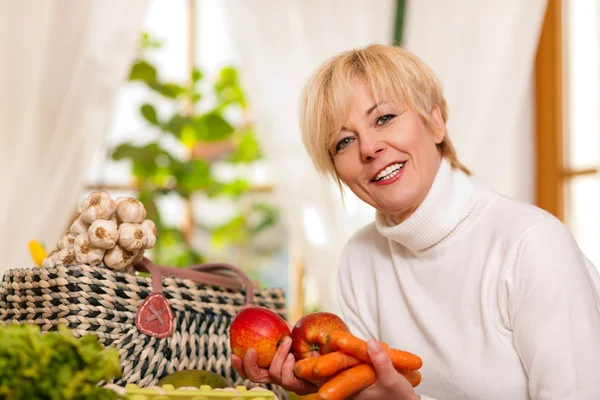 stock image Woman with groceries she just