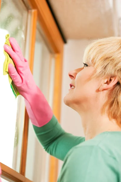 Mature woman cleaning her — Stock Photo, Image
