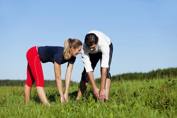 Young fitness couple doing — Stock Photo, Image