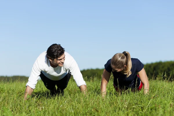 Young fitness couple doing — Stock Photo, Image