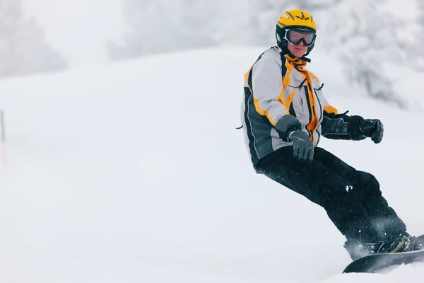 Snowboarder in the alps doing — Stock Photo, Image