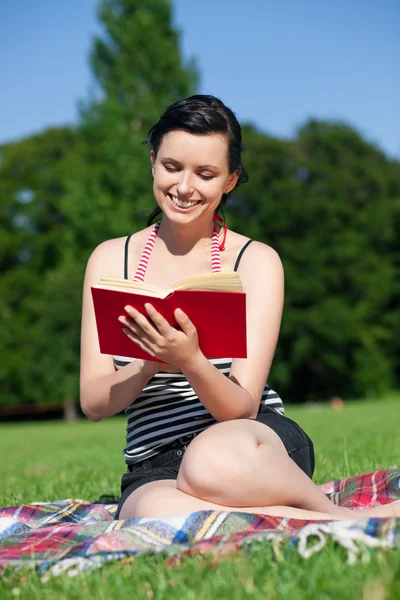 Woman reading book in the — Stock Photo, Image