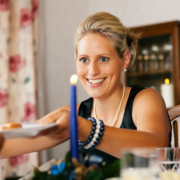 Woman at a Christmas dinner — Stock Photo, Image