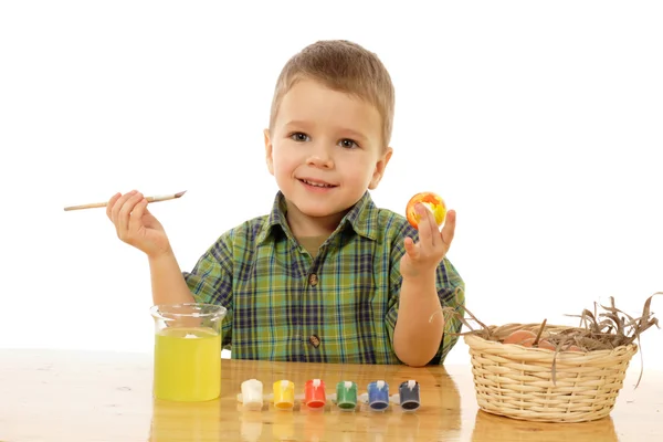 stock image Little child painting the easter eggs