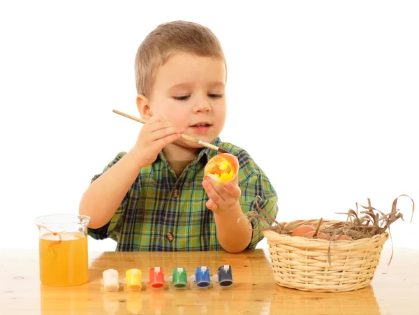 stock image Little child painting the easter eggs