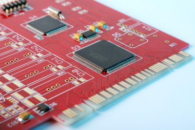 Electronic board - red PCI card close-up clipart