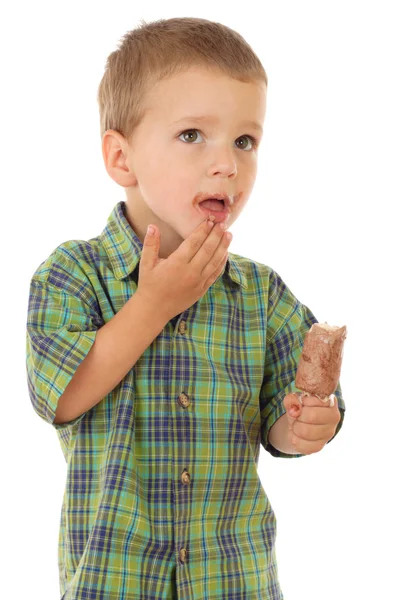 Niño pensativo con helado de chocolate —  Fotos de Stock
