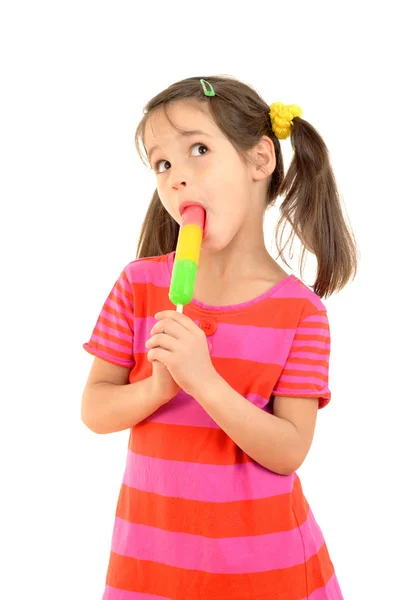 Little girl licking the color ice cream — Stock Photo, Image