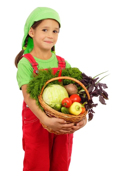 Little girl with basket of vegetables — Stock Photo, Image