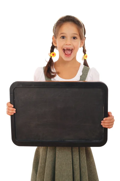 Little emotional schoolgirl with empty chalkboard — Stock Photo, Image