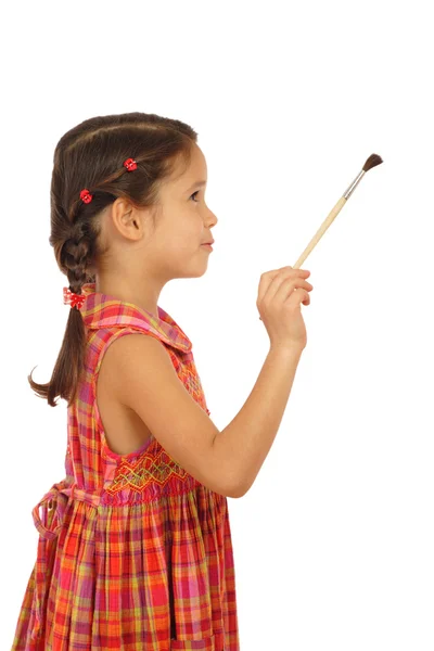 Bir boya fırçası ile küçük kız — Stok fotoğraf