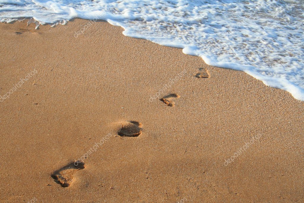 Footprints on the sea's sand — Stock Photo © sbworld7 #4886118