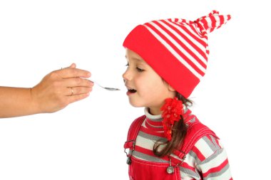 Little open-mouthed girl with spoon held by the adult person's hand clipart