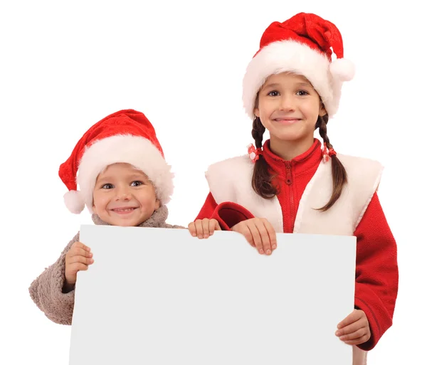 Noel şapka ile boş bir bayrak'ın küçük çocuklarda — Stok fotoğraf