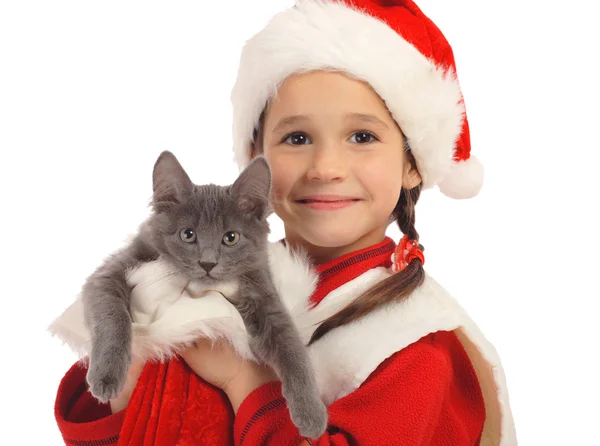 Little girl in Christmas hat with gray kitty — Stock Photo, Image
